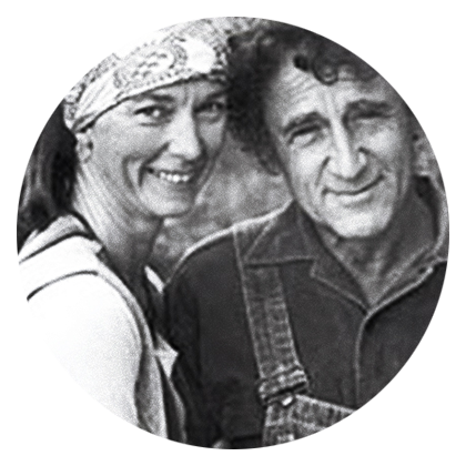 Greyscale photograph of iUniverse author Georg Rauch with wife Phyllis, outside. 