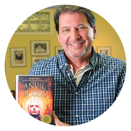 iUniverse author J. Boyce Gleason in his home holding his published book, Anvil of God. 